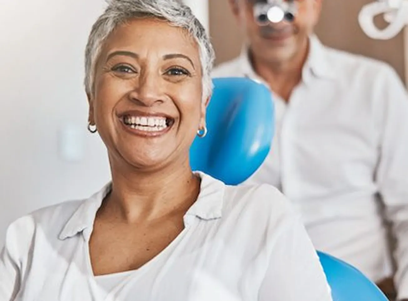 Smiling woman sitting in a dental chair